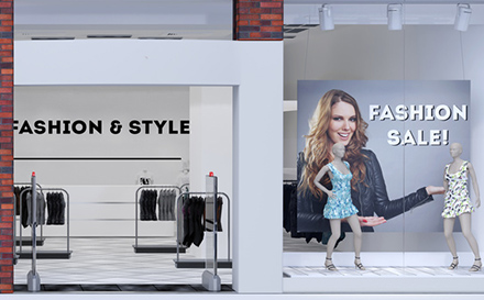 Picture of shop window display with text Sale on red poster